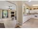Open-concept living space with kitchen and living room with lots of light at 12178 Se 174Th Pl, Summerfield, FL 34491