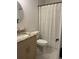 Charming bathroom with decorative shower curtain, granite countertop, and modern toilet at 1245 Nw 73Rd Ter, Ocala, FL 34482
