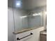 Bathroom featuring frameless glass shower partition, granite half-wall, and granite vanity at 1245 Nw 73Rd Ter, Ocala, FL 34482