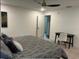 Cozy bedroom featuring a ceiling fan, desk, chair, and a neutral color scheme at 1245 Nw 73Rd Ter, Ocala, FL 34482