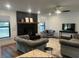 Inviting living room boasts a modern fireplace, comfortable seating, and an open, airy layout at 1245 Nw 73Rd Ter, Ocala, FL 34482
