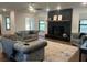 Open-concept living room with a large fireplace, stylish furnishings, and a seamless flow throughout at 1245 Nw 73Rd Ter, Ocala, FL 34482