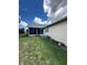 Backyard screened-in patio offers outdoor living space at 13506 Sw 43Rd Cir, Ocala, FL 34473