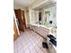 Primary bathroom featuring double sinks and vanity, with tile flooring at 13506 Sw 43Rd Cir, Ocala, FL 34473