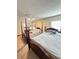 This bedroom features 2 4-poster beds, mirrored closet doors and a ceiling fan at 13506 Sw 43Rd Cir, Ocala, FL 34473
