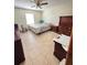 A secondary bedroom featuring a neutral paint, a standard closet, and tile floors at 13506 Sw 43Rd Cir, Ocala, FL 34473