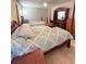 Bedroom with carpet, ceiling fan, and decorative furniture at 13506 Sw 43Rd Cir, Ocala, FL 34473