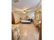 Main bedroom with neutral paint, tray ceiling, ceiling fan and tile floors at 13506 Sw 43Rd Cir, Ocala, FL 34473