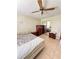This bedroom features a closet with mirrored doors and neutral colored tile flooring at 13506 Sw 43Rd Cir, Ocala, FL 34473