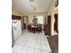 Cozy dining area with window, tiled floors, and adjacent kitchen, offering an inviting atmosphere at 13506 Sw 43Rd Cir, Ocala, FL 34473