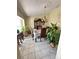 Dining room with decorative chandelier, table, and lush plants at 13506 Sw 43Rd Cir, Ocala, FL 34473