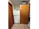 Hallway with refrigerator and wood doors at 13506 Sw 43Rd Cir, Ocala, FL 34473