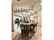 Bright kitchen with island seating featuring stainless appliances and tiled floors at 13506 Sw 43Rd Cir, Ocala, FL 34473