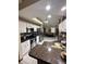 Bright kitchen features granite countertops, stainless steel appliances, and white cabinetry at 13506 Sw 43Rd Cir, Ocala, FL 34473