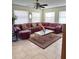 Inviting living room with comfortable seating, ceiling fan and natural light at 13506 Sw 43Rd Cir, Ocala, FL 34473