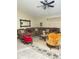 Bright living room with neutral paint, ceiling fan, and comfortable seating at 13506 Sw 43Rd Cir, Ocala, FL 34473