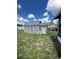 Backyard shed with gray metal roof offers extra storage at 13506 Sw 43Rd Cir, Ocala, FL 34473