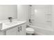 Bright bathroom featuring a tub with shower, white cabinets, and quartz countertop at 14876 Se 34Th Ter, Summerfield, FL 34491