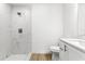 Bathroom features a walk-in shower, granite vanity and tiled floor at 14876 Se 34Th Ter, Summerfield, FL 34491