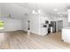 Bright and airy living room features an open floor plan into the kitchen at 14876 Se 34Th Ter, Summerfield, FL 34491