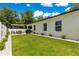 Well maintained backyard with lush lawn, landscaping and covered patio at 155 Marion Oaks Pass, Ocala, FL 34473