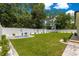 Picture of a well-maintained backyard with a small round pool and manicured lawn at 155 Marion Oaks Pass, Ocala, FL 34473