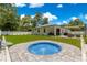 Spacious backyard with a small pool, patio, and lush green grass, ideal for entertaining at 155 Marion Oaks Pass, Ocala, FL 34473