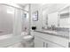 Bathroom featuring vanity with granite counters, tub with shower, and tiled flooring at 155 Marion Oaks Pass, Ocala, FL 34473