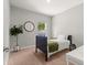 This bedroom is brightly lit and features a desk and a large indoor plant at 155 Marion Oaks Pass, Ocala, FL 34473