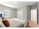 Bedroom with plush bed, carpeted floors, a window and a closet with double doors at 155 Marion Oaks Pass, Ocala, FL 34473