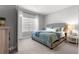 Comfortable bedroom featuring plush carpet, decorative accents, and natural light at 155 Marion Oaks Pass, Ocala, FL 34473