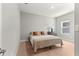 Cozy bedroom with a comfortable bed, carpet flooring, a window and neutral decor at 155 Marion Oaks Pass, Ocala, FL 34473
