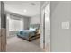 Comfortable bedroom featuring plush carpet, decorative accents, and natural light at 155 Marion Oaks Pass, Ocala, FL 34473