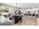 Light-filled dining area adjacent to kitchen features dark wood table and chairs and sliding door to patio at 155 Marion Oaks Pass, Ocala, FL 34473