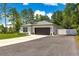 Beautiful single-story home with a two-car garage, a wide driveway, and manicured landscaping at 155 Marion Oaks Pass, Ocala, FL 34473