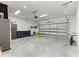 Spacious garage with a concrete floor and ample storage space at 155 Marion Oaks Pass, Ocala, FL 34473
