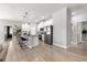Spacious kitchen features stainless steel refrigerator, island with bar stool seating, and lots of natural light at 155 Marion Oaks Pass, Ocala, FL 34473