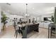 Open-concept living space featuring dining area, kitchen, and living room with modern furnishings at 155 Marion Oaks Pass, Ocala, FL 34473