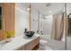 Bathroom featuring granite counters, modern fixtures, and tiled shower with tub at 158 Guava Pass, Ocklawaha, FL 32179