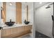 Stylish bathroom featuring double sinks, modern fixtures, and a luxurious walk-in shower at 158 Guava Pass, Ocklawaha, FL 32179