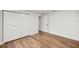 Bedroom featuring wood-look flooring and a closet with bi-fold doors at 158 Guava Pass, Ocklawaha, FL 32179