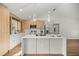 Contemporary kitchen with stylish cabinetry, stainless steel appliances, and a large center island at 158 Guava Pass, Ocklawaha, FL 32179