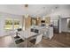 Stylish kitchen with stainless steel appliances, white countertops, and contemporary pendant lighting at 158 Guava Pass, Ocklawaha, FL 32179