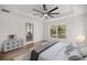 Inviting main bedroom featuring a large window and ensuite bathroom at 158 Guava Pass, Ocklawaha, FL 32179