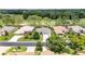 Aerial view showcasing the home's location near the golf course and tree-lined streets at 16023 Sw 14Th Avenue Rd, Ocala, FL 34473