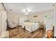 Cozy bedroom featuring hardwood floors, lots of natural light, and a seating area at 16023 Sw 14Th Avenue Rd, Ocala, FL 34473