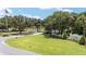 Community entrance featuring lush landscaping, decorative signage, and a welcoming atmosphere at 16023 Sw 14Th Avenue Rd, Ocala, FL 34473