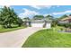 Charming single-story home with a well-manicured lawn and a three-car garage at 16023 Sw 14Th Avenue Rd, Ocala, FL 34473