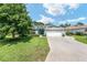 Charming single-story home with a well-manicured lawn and a three-car garage at 16023 Sw 14Th Avenue Rd, Ocala, FL 34473