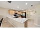 Bright kitchen with stainless steel appliances, light wood cabinets, tiled floors, and long countertops at 16023 Sw 14Th Avenue Rd, Ocala, FL 34473